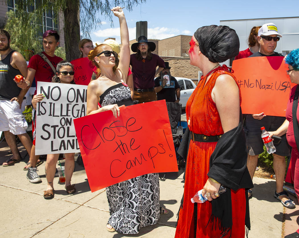 Tamara Taylor, left, with the Las Vegas Democratic Socialists of America, chants with Melissa A ...