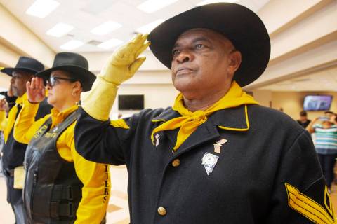 Mitchell Sayles, right, Tiffany Barnett and Kelly Hawthorne salute during Buffalo Soldiers Day ...