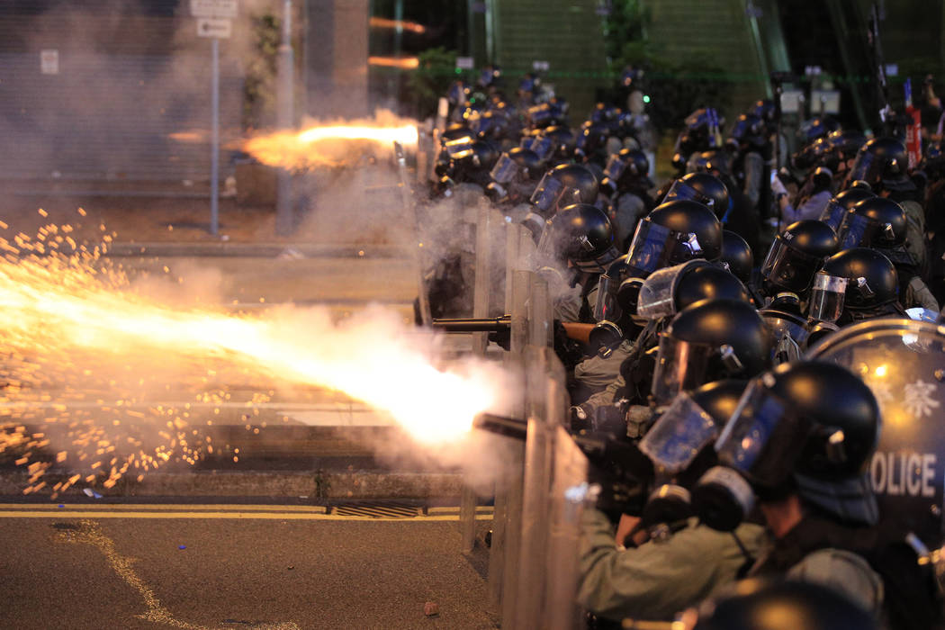 Hong Kong police fire tear gas at protesters in Sai Wan, Hong Kong on Sunday, July 28, 2019. Po ...