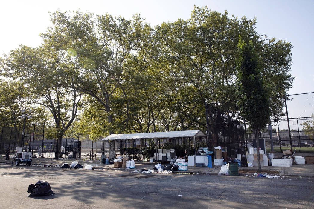 The remains of a party remain litter a playground in the Brownsville neighborhood in the Brookl ...