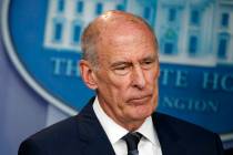 FILE - In this Aug. 2, 2018, file photo, Director of National Intelligence Dan Coats listens du ...