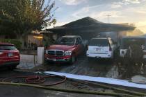 Crews battle a fire at a home in the 600 block of Watkins Drive in Las Vegas on Sunday, July 28 ...