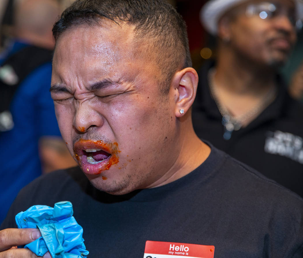 Competitor Joey Maganis winces in pain from too much hot sauce as PT's Ranch hosts a $4,000 win ...