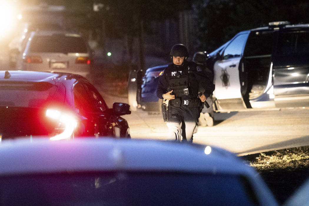 Police work a scene after a deadly shooting at the Gilroy Garlic Festival in Gilroy, Calif., Su ...