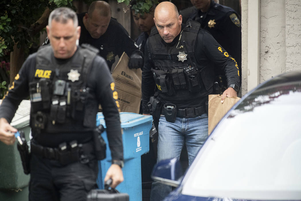 Police officers carry evidence bags from the family home of Gilroy Garlic Festival gunman Santi ...