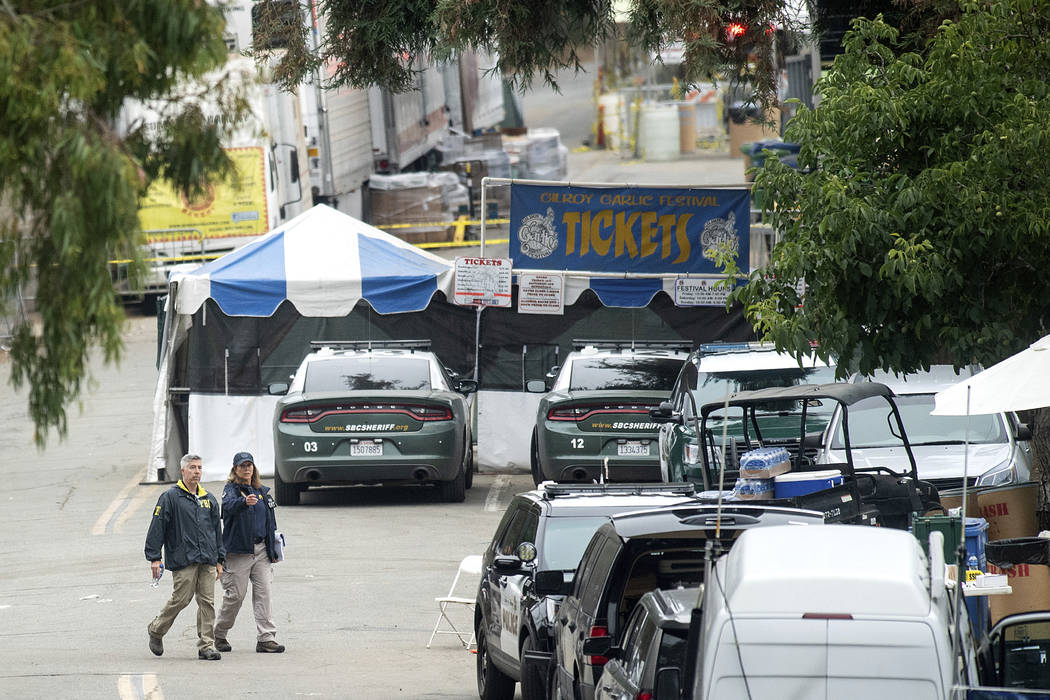 FBI personnel pass a ticket booth at the Gilroy Garlic Festival Monday, July 29, 2019 in Calif. ...