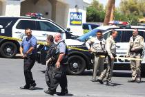 Las Vegas police at the scene of an officer-involved shooting at Kensington Suites in the 2200 ...