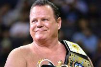 Professional wrestler Jerry "The King" Lawler stands on the court during a break in p ...