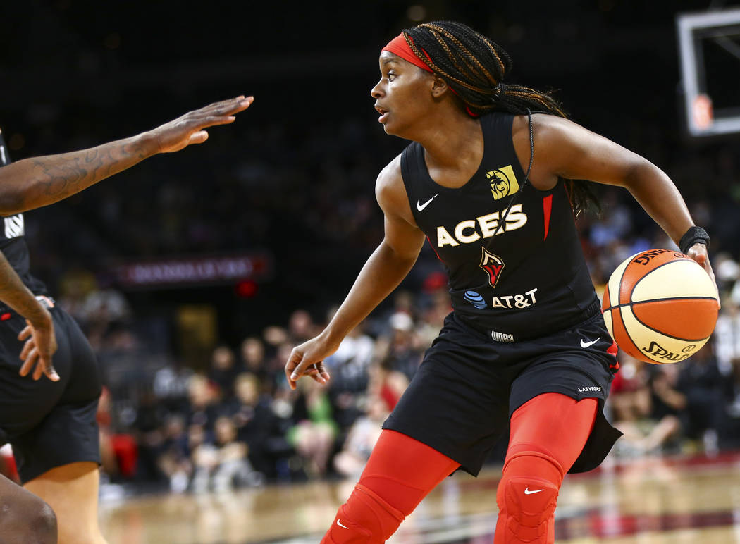 Las Vegas Aces guard Sugar Rodgers moves the ball against the Seattle Storm during the second h ...