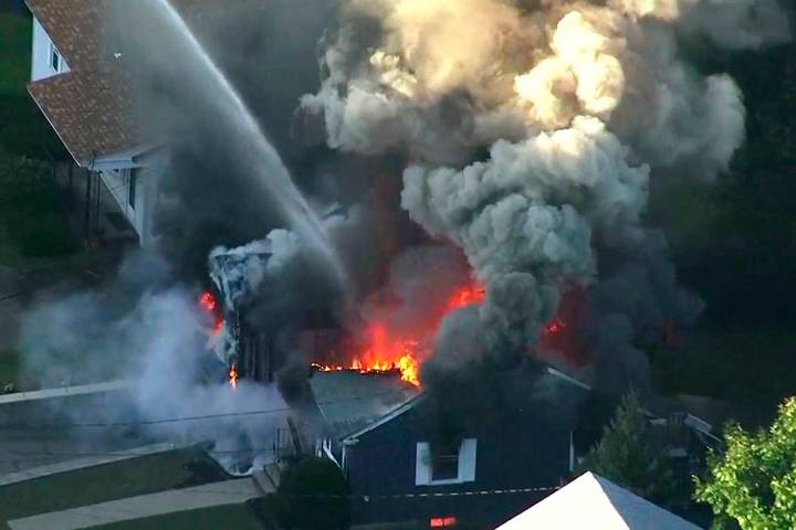 FILE - In this Sept. 13, 2018 file image from video provided by WCVB in Boston, flames consume ...