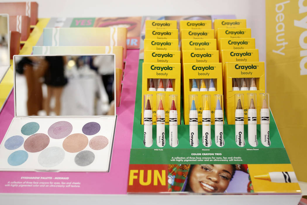Crayola Beauty displays their vibrant face crayons, lip and cheek crayons and different palette ...