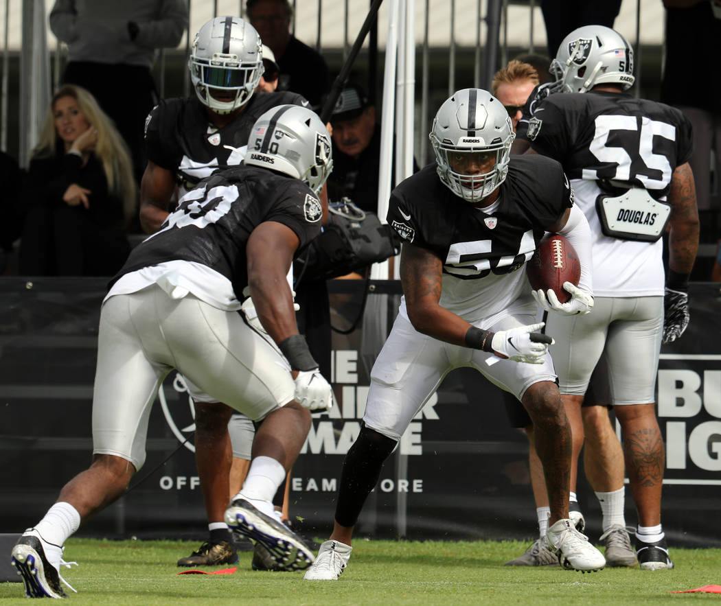 Oakland Raiders linebacker Nicholas Morrow (50) comes in to tackle inside linebacker Brandon Ma ...