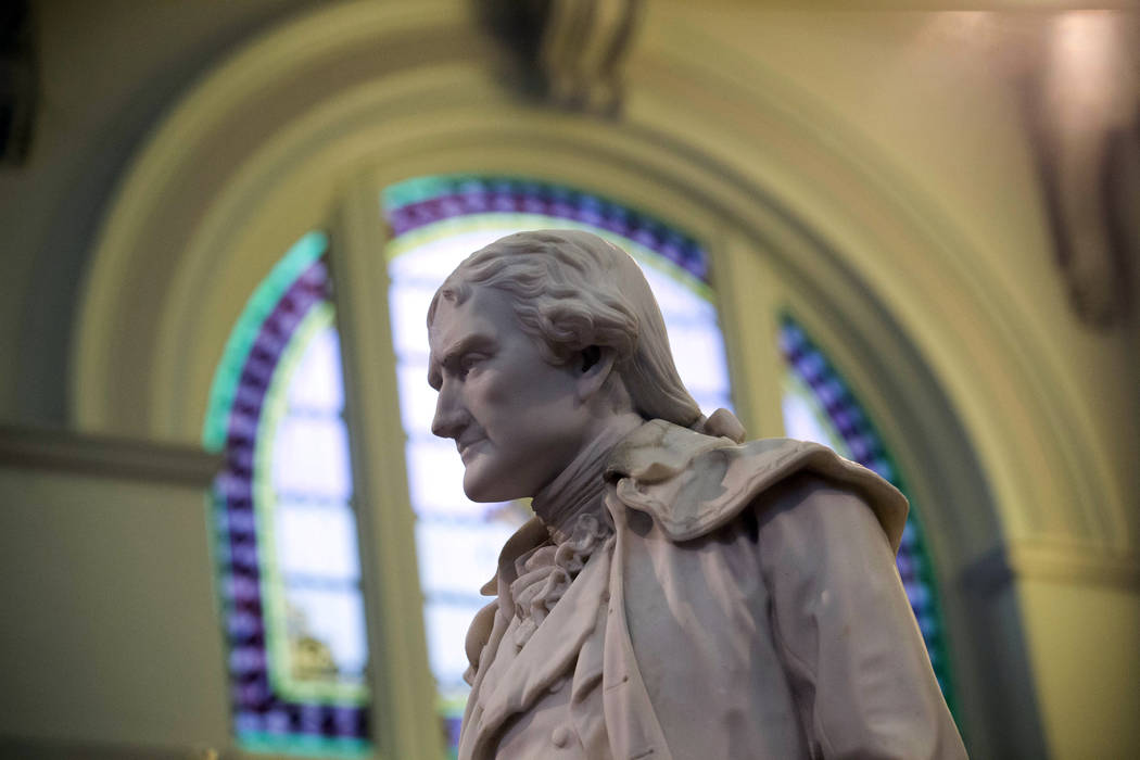 A Feb. 17, 2016, file photo shows statue of Thomas Jefferson greeting visitors in the main lobb ...