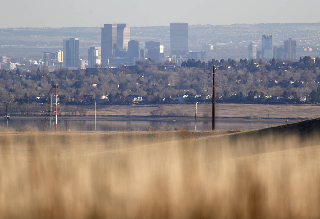 FILE - In this Nov. 18, 2018, file photo, the Denver skyline is visible from the prairies in th ...