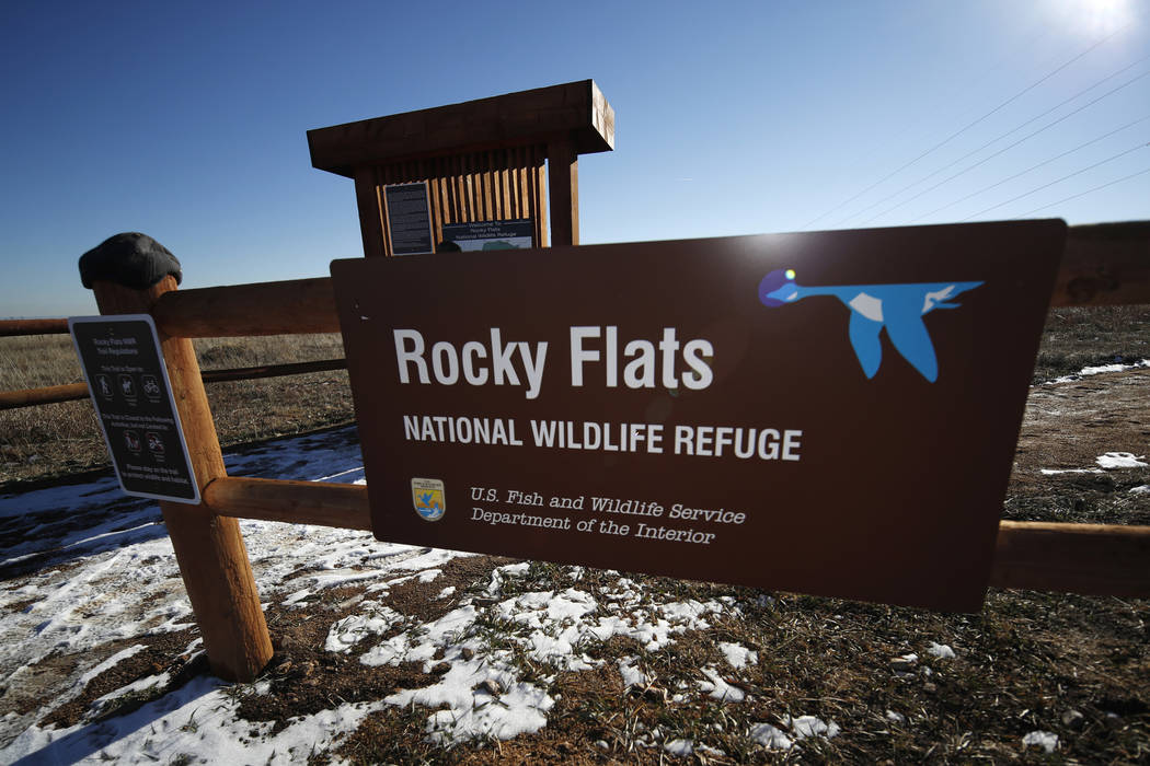 FILE - In this Nov. 18, 2018, file photo, a sign marks a trailhead at the Rocky Flats National ...