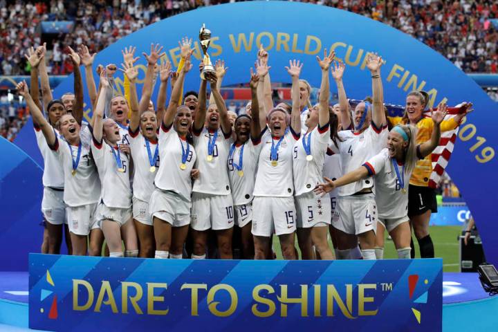 United States' team celebrates with the trophy after winning the Women's World Cup final soccer ...