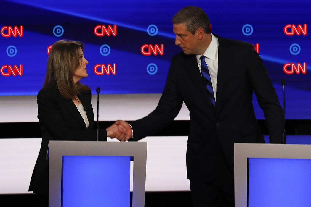 Marianne Williamson and Rep. Tim Ryan, D-Ohio, shake hands after the first of two Democratic pr ...