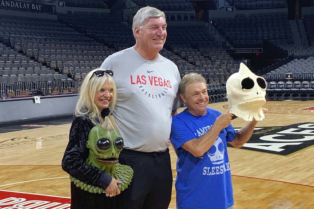 Bill Laimbeer, center, coach of the WNBA's Las Vegas Aces basketball team, poses for photos wit ...