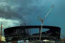 Storm clouds form behind construction of the Las Vegas Stadium in Las Vegas, Wednesday, July 31 ...