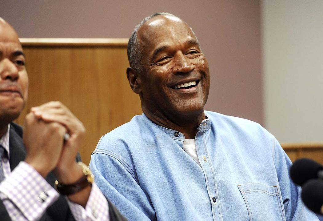 In this July 20, 2017, file photo, former NFL football star O.J. Simpson reacts after learning ...