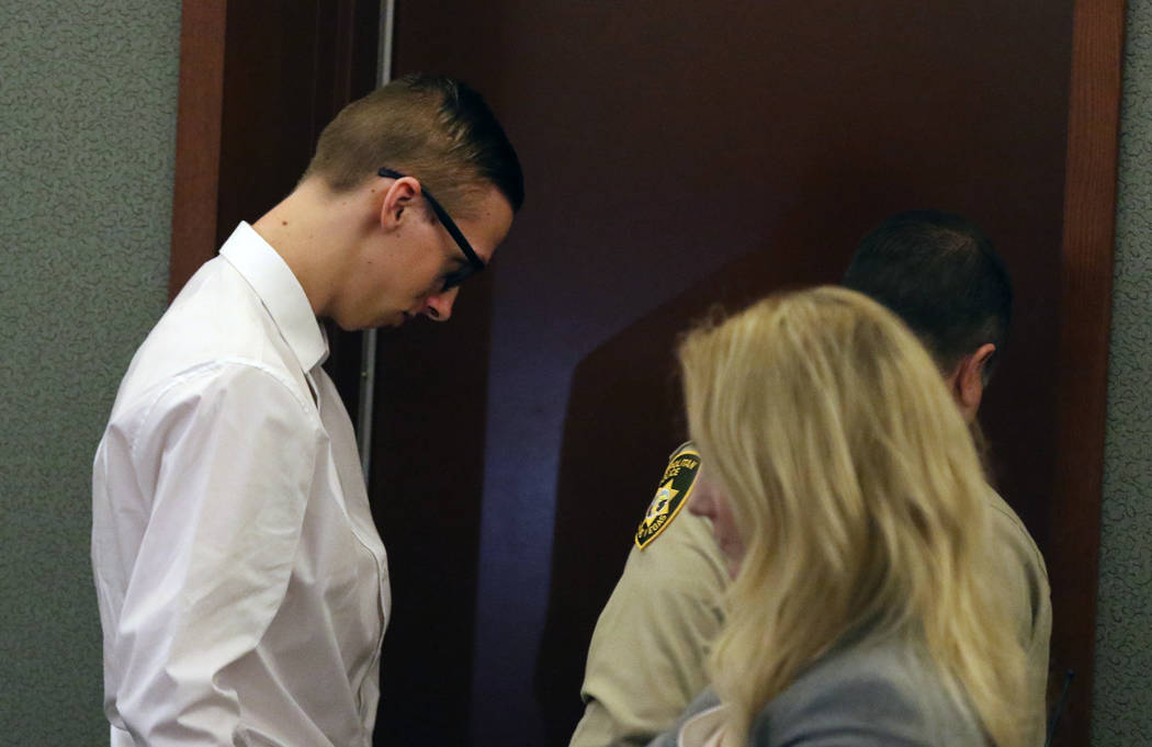 Kody Harlan, 17, is led out of the courtroom at the Regional Justice Center on Wednesday, July ...