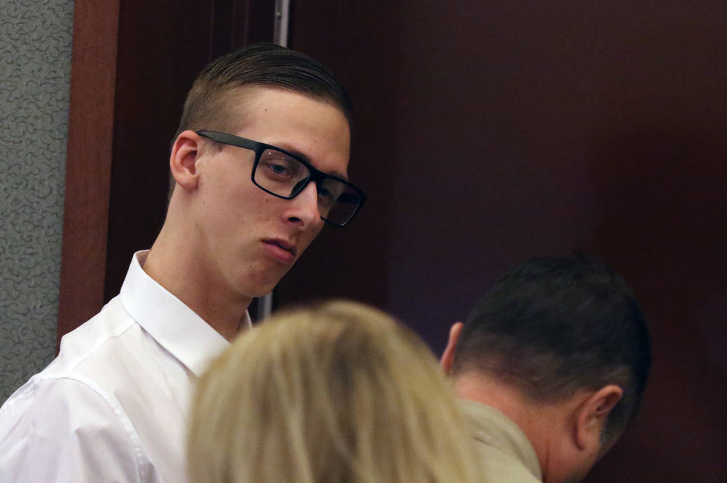 Kody Harlan, 17, is led out of the courtroom at the Regional Justice Center on Wednesday, July ...