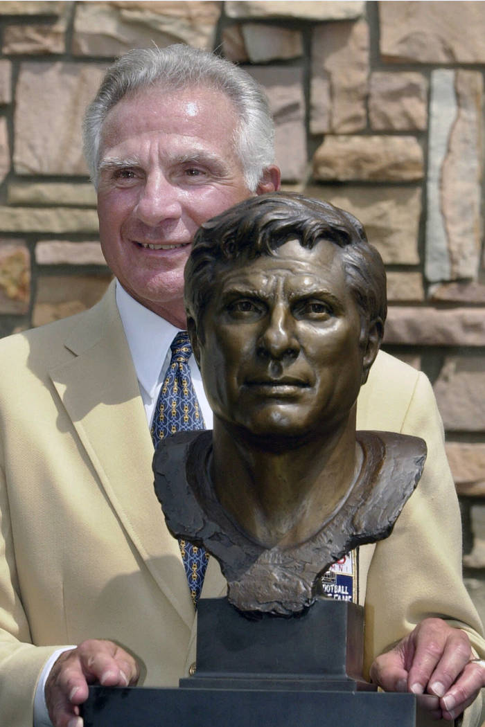 FILE - In this Aug. 4, 2001, file photo, former Miami Dolphins great Nick Buoniconti holds his ...