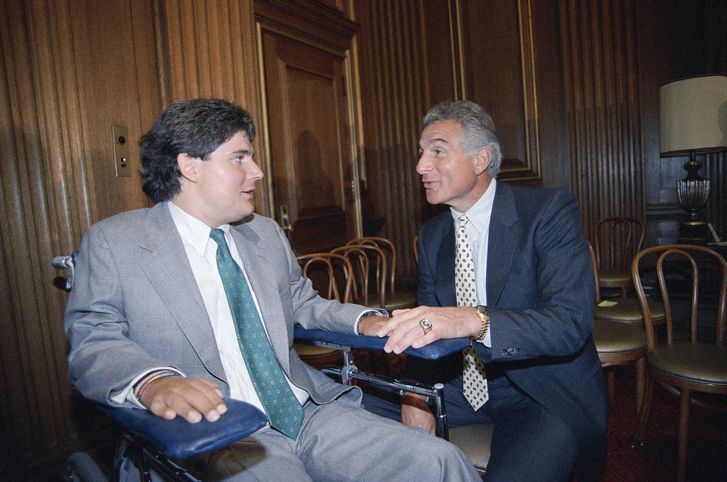 FILE - In this June 28, 1989, file photo, Marc Buoniconti, left, and his father, former Miami D ...