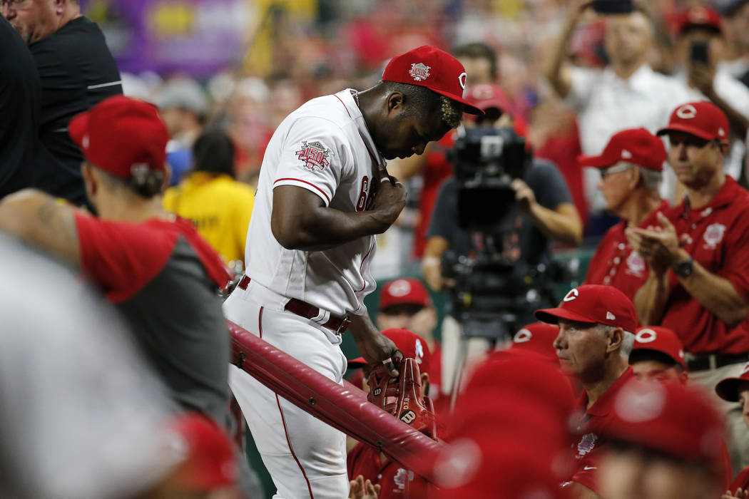 Cincinnati Reds right fielder Yasiel Puig leaves the field at the end of  the top of the ninth i …