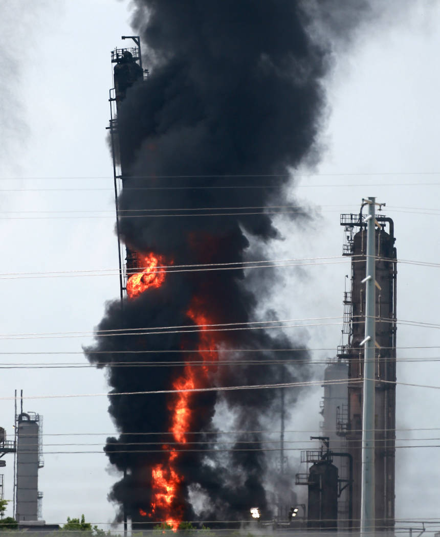 Flames and smoke rise after a fire started at an Exxon Mobil facility, Wednesday, July 31, 2019 ...