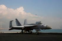An F/A-18 Super Hornet fighter jet is seen on the deck of the U.S. Navy USS Ronald Reagan aircr ...