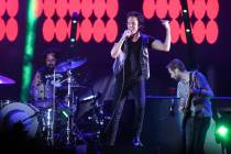 Brandon Flowers performs with The Killers during a surprise appearance at the Life is Beautiful ...