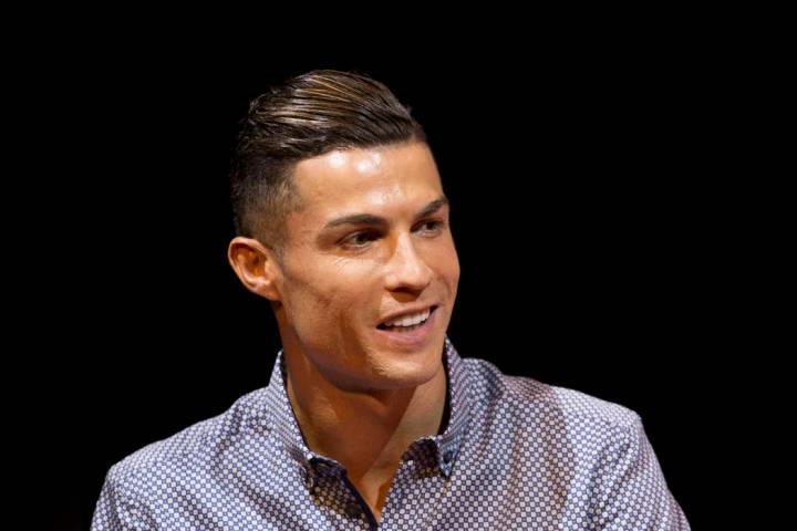 Juventus soccer player Cristiano Ronaldo speaks after receiving the Lifetime Achievement award ...