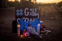 Candles burn at a makeshift memorial for Gilroy Garlic Festival shooting victims outside the fe ...