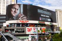 A digital billboard displays Oakland Raiders coach Jon Gruden in an advertisement for the upcom ...