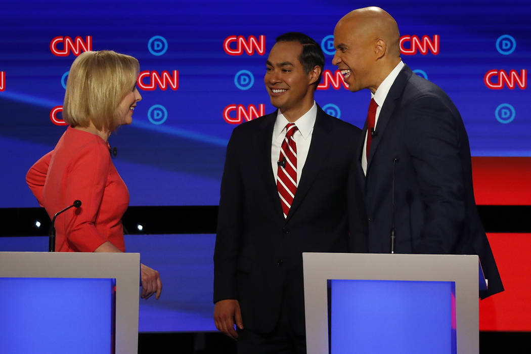 Sen. Cory Booker, D-N.J., Sen. Kirsten Gillibrand, D-N.Y. and former Housing and Urban Developm ...