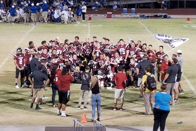 Members of Desert Oasis‘ football team celebrate after the team‘s 19-6 victory o ...