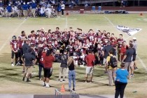 Members of Desert Oasis‘ football team celebrate after the team‘s 19-6 victory o ...