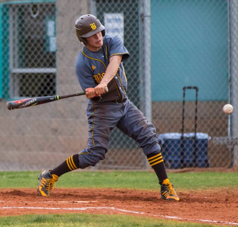 Bonanza shortstop Luis Lares (17) hits a single in the third inning during a baseball game a ...