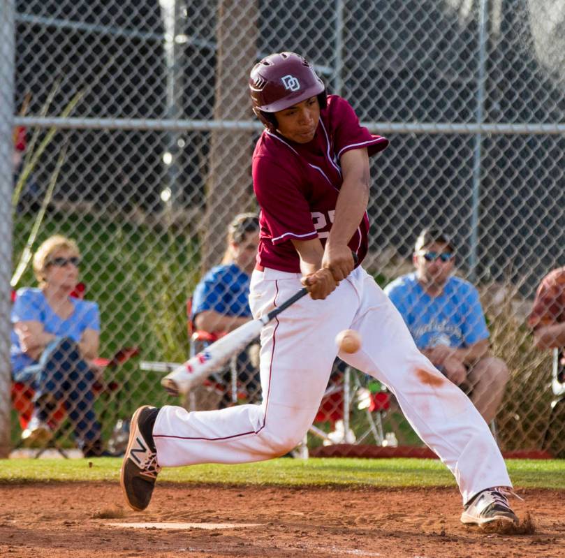 Desert Oasis infielder Aaron Roberts (25) hits the last ball of the game during the champion ...