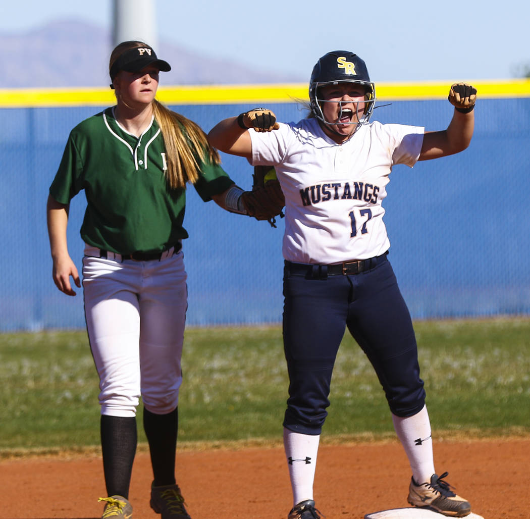 Shadow Ridge shortstop Alisha Schultz (17) celebrates at second base after hitting a double ...