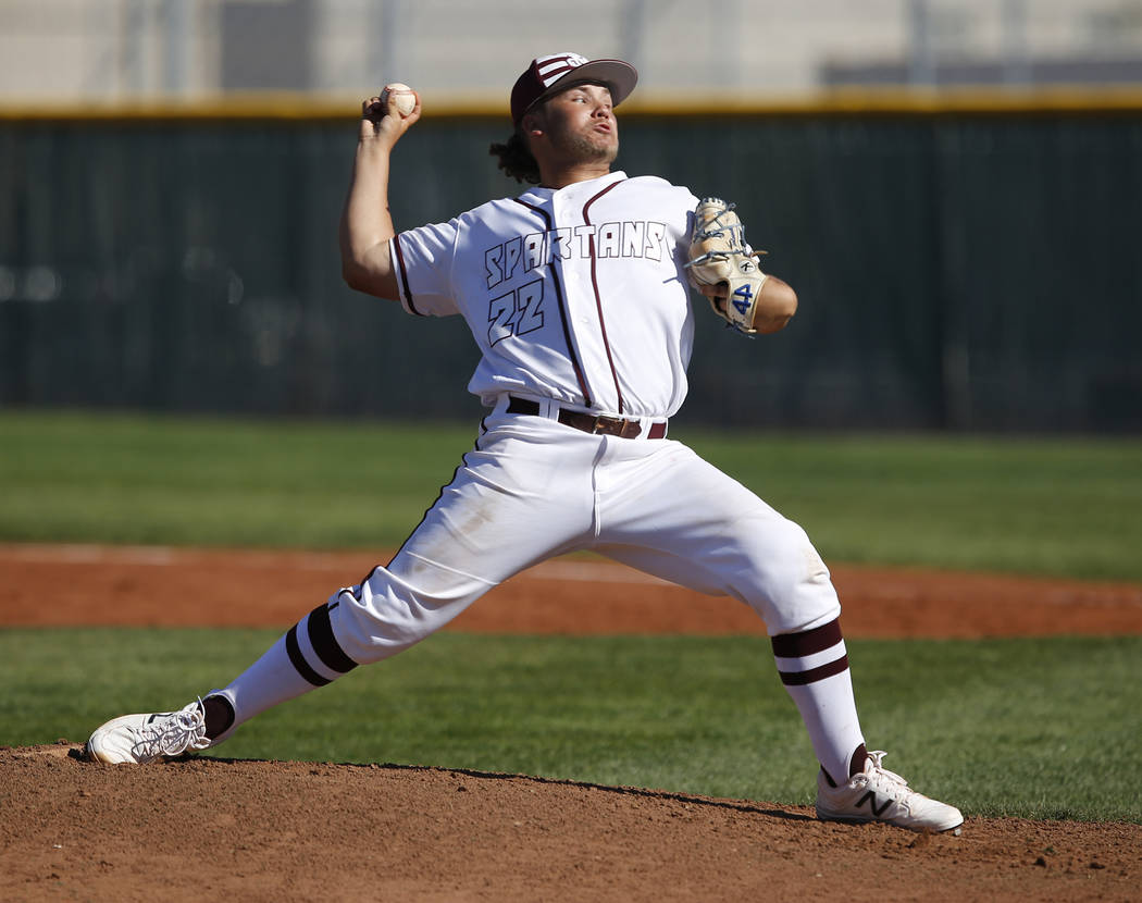 Cimarron-Memorial’s Cody Kozlowski (22) pitches during a high school baseball game aga ...