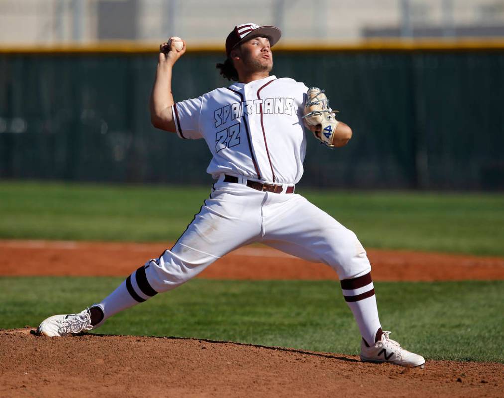 Cimarron-Memorial’s Cody Kozlowski (22) pitches during a high school baseball game aga ...