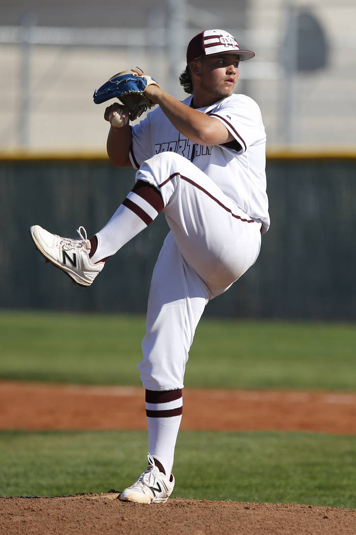 Cimarron-Memorial’s Cody Kozlowski (22) pitches during a high school baseball game aga ...