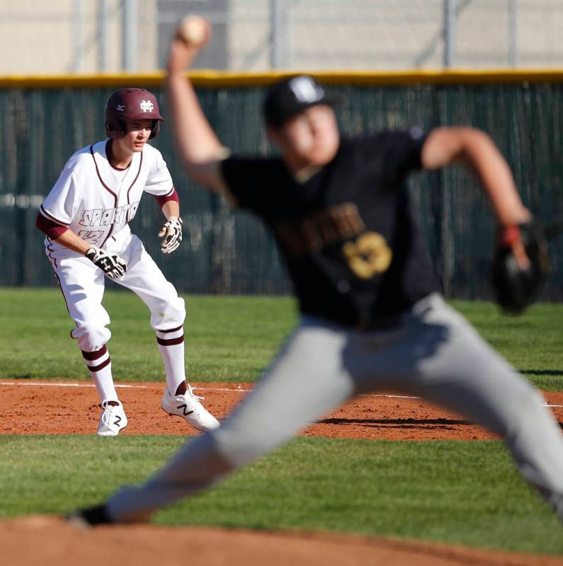 Cimarron-Memorial’s Jack Kannon (12) leads off first base as Faith Lutheran’s Au ...