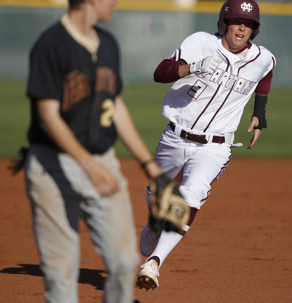 Cimarron-Memorial’s Trevor Doyle (9) runs towards third base during a high school base ...