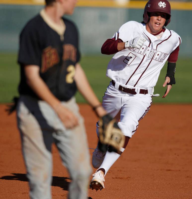 Cimarron-Memorial’s Trevor Doyle (9) runs towards third base during a high school base ...