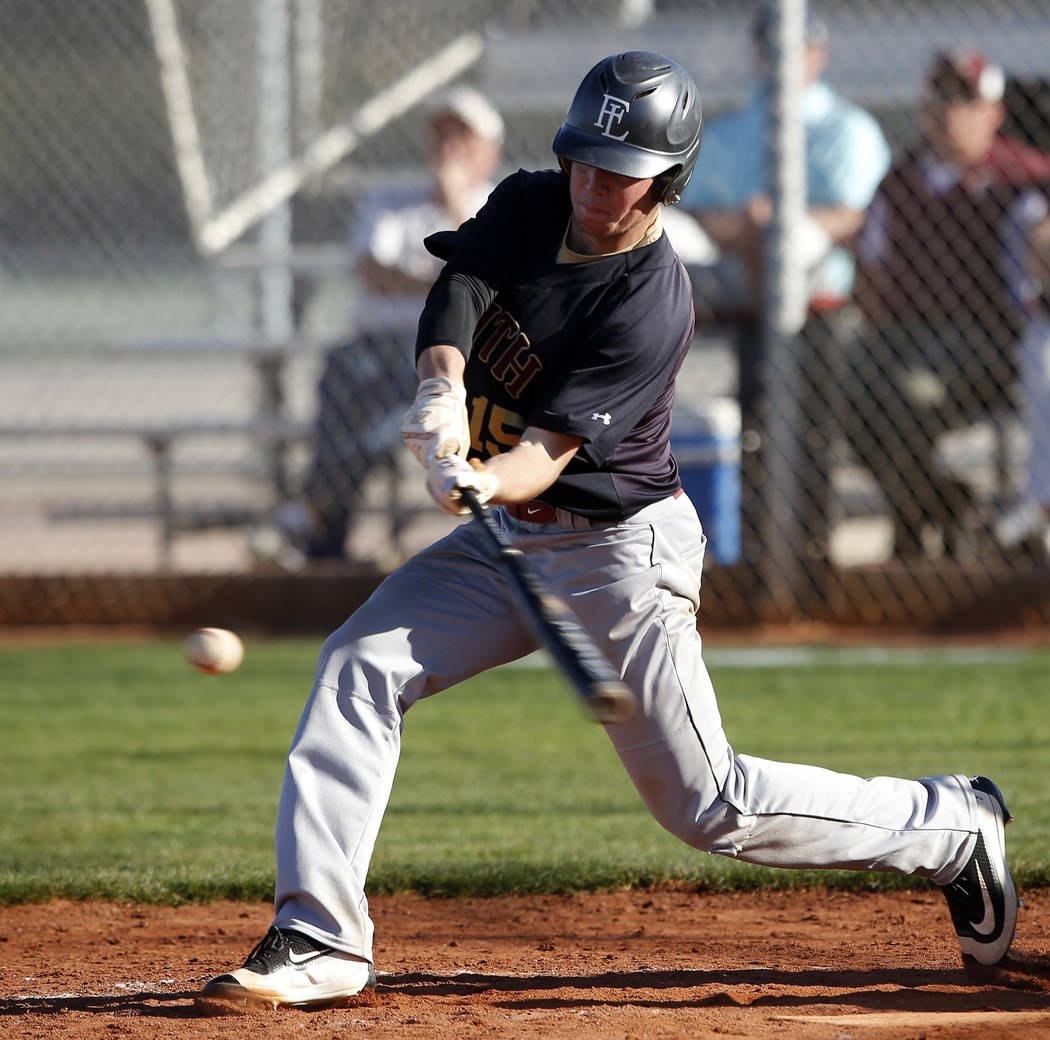 Faith Lutheran’s Sagan Gronauer (15) swings during a high school baseball game against ...