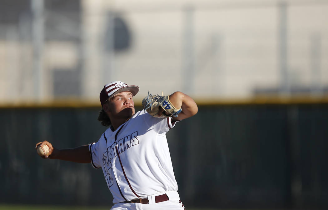 Cimarron-Memorial’s Cody Kozlowski (22) pitches during a high school baseball game aga ...