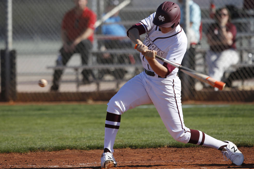 Cimarron-Memorial’s Noah Parker (19) swings during a high school baseball game against ...